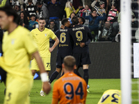 Juventus forward Dusan Vlahovic (9) and Juventus defender Danilo (6) celebrate after scoring the goal to make it 1-0 during the Serie A foot...