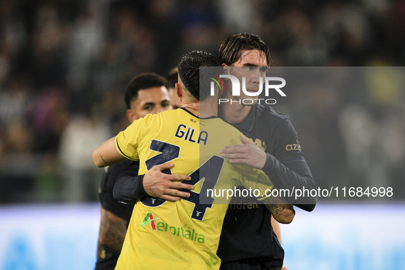 Lazio defender Mario Gila (34) hugs Juventus forward Dusan Vlahovic (9) after the Serie A football match number 8, Juventus versus Lazio, at...