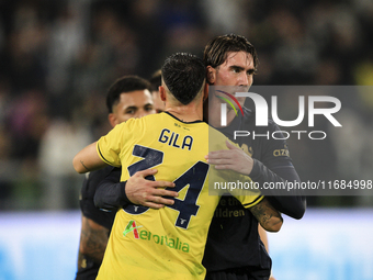 Lazio defender Mario Gila (34) hugs Juventus forward Dusan Vlahovic (9) after the Serie A football match number 8, Juventus versus Lazio, at...