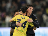 Lazio defender Mario Gila (34) hugs Juventus forward Dusan Vlahovic (9) after the Serie A football match number 8, Juventus versus Lazio, at...