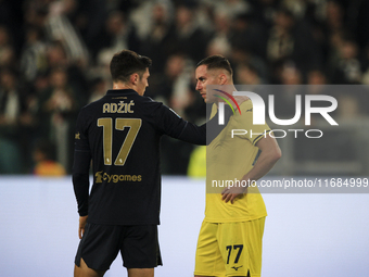 Juventus midfielder Vasilije Adzic (17) talks with Lazio defender Adam Marusic (77) after the Serie A football match number 8, Juventus vers...