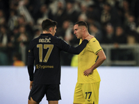 Juventus midfielder Vasilije Adzic (17) talks with Lazio defender Adam Marusic (77) after the Serie A football match number 8, Juventus vers...