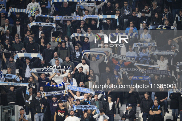 Lazio supporters cheer during the Serie A football match number 8, Juventus versus Lazio, at the Allianz Stadium in Turin, Piedmont, Italy,...