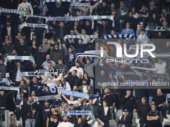 Lazio supporters cheer during the Serie A football match number 8, Juventus versus Lazio, at the Allianz Stadium in Turin, Piedmont, Italy,...