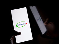 The Supermicro logo displays on a smartphone screen in Athens, Greece, on October 20, 2024. (