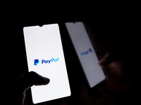 The PayPal logo displays on a smartphone screen in Athens, Greece, on October 20, 2024. (