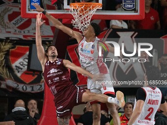 John Petrucelli of Trapani Shark and Kaodirichi Akobundu-Ehiogu of Openjobmetis Varese participate in the LBA Italy Championship match betwe...