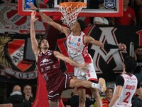 John Petrucelli of Trapani Shark and Kaodirichi Akobundu-Ehiogu of Openjobmetis Varese participate in the LBA Italy Championship match betwe...