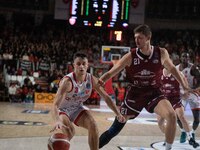 Matteo Librizzi of Openjobmetis Varese and Tibor Pleiss of Trapani Shark participate in the LBA Italy Championship match between Openjobmeti...