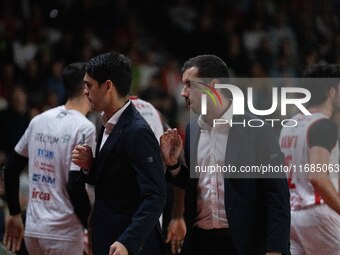 Head Coach Herman Mandole of Openjobmetis Varese and Marco Legovich participate in the LBA Italy Championship match between Openjobmetis Var...