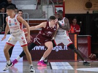 Amar Alibegovic of Trapani Shark and Gabe Brown of Openjobmetis Varese compete during the LBA Italy Championship match between Openjobmetis...