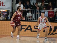 Stefano Gentile of Trapani Shark and Matteo Librizzi of Openjobmetis Varese compete during the LBA Italy Championship match between Openjobm...