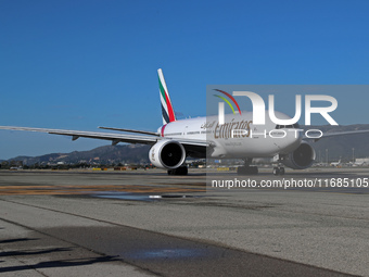 A Boeing 777-21H(LR) of Emirates begins the run for takeoff at Barcelona El Prat Airport in Barcelona, Spain, on October 8, 2024. (