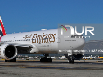 A Boeing 777-21H(LR) of Emirates begins the run for takeoff at Barcelona El Prat Airport in Barcelona, Spain, on October 8, 2024. (