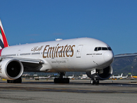 A Boeing 777-21H(LR) of Emirates begins the run for takeoff at Barcelona El Prat Airport in Barcelona, Spain, on October 8, 2024. (