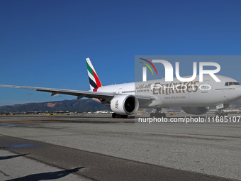 A Boeing 777-21H(LR) of Emirates begins the run for takeoff at Barcelona El Prat Airport in Barcelona, Spain, on October 8, 2024. (