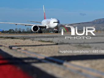 A Boeing 777-21H(LR) of Emirates begins the run for takeoff at Barcelona El Prat Airport in Barcelona, Spain, on October 8, 2024. (