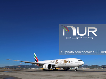 A Boeing 777-21H(LR) of Emirates begins the run for takeoff at Barcelona El Prat Airport in Barcelona, Spain, on October 8, 2024. (