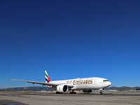 A Boeing 777-21H(LR) of Emirates begins the run for takeoff at Barcelona El Prat Airport in Barcelona, Spain, on October 8, 2024. (