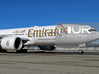 A Boeing 777-21H(LR) of Emirates begins the run for takeoff at Barcelona El Prat Airport in Barcelona, Spain, on October 8, 2024. (