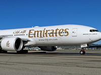 A Boeing 777-21H(LR) of Emirates begins the run for takeoff at Barcelona El Prat Airport in Barcelona, Spain, on October 8, 2024. (