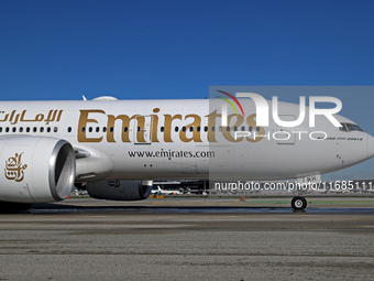 A Boeing 777-21H(LR) of Emirates begins the run for takeoff at Barcelona El Prat Airport in Barcelona, Spain, on October 8, 2024. (