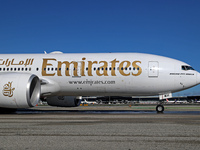 A Boeing 777-21H(LR) of Emirates begins the run for takeoff at Barcelona El Prat Airport in Barcelona, Spain, on October 8, 2024. (