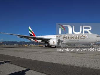 A Boeing 777-21H(LR) of Emirates begins the run for takeoff at Barcelona El Prat Airport in Barcelona, Spain, on October 8, 2024. (