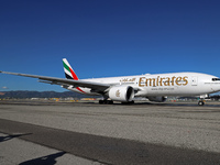 A Boeing 777-21H(LR) of Emirates begins the run for takeoff at Barcelona El Prat Airport in Barcelona, Spain, on October 8, 2024. (