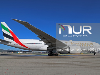 A Boeing 777-21H(LR) of Emirates begins the run for takeoff at Barcelona El Prat Airport in Barcelona, Spain, on October 8, 2024. (