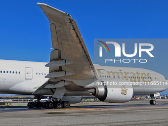 A Boeing 777-21H(LR) of Emirates begins the run for takeoff at Barcelona El Prat Airport in Barcelona, Spain, on October 8, 2024. (