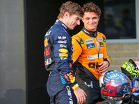 Lando Norris of the UK drives the (4) McLaren F1 Team MCL38 Mercedes, and Max Verstappen of the Netherlands drives the (1) Oracle Red Bull R...