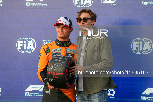 Lando Norris of the UK drives the McLaren F1 Team MCL38 Mercedes, and Armand Duplantis is present during the qualifying for the Formula 1 Pi...