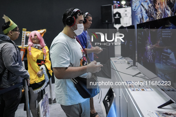 Gamers play video games at the Thailand Game Show 2024 in Bangkok, Thailand, on October 20, 2024. The Thailand Game Show 2024 gaming event t...