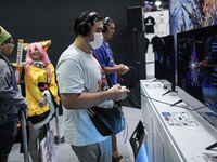 Gamers play video games at the Thailand Game Show 2024 in Bangkok, Thailand, on October 20, 2024. The Thailand Game Show 2024 gaming event t...