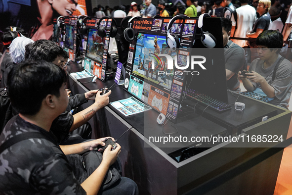 Gamers play video games at the Thailand Game Show 2024 in Bangkok, Thailand, on October 20, 2024. The Thailand Game Show 2024 gaming event t...