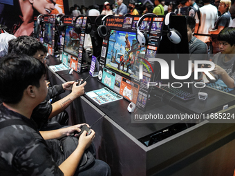 Gamers play video games at the Thailand Game Show 2024 in Bangkok, Thailand, on October 20, 2024. The Thailand Game Show 2024 gaming event t...