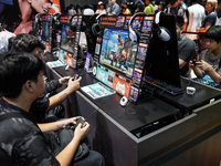 Gamers play video games at the Thailand Game Show 2024 in Bangkok, Thailand, on October 20, 2024. The Thailand Game Show 2024 gaming event t...