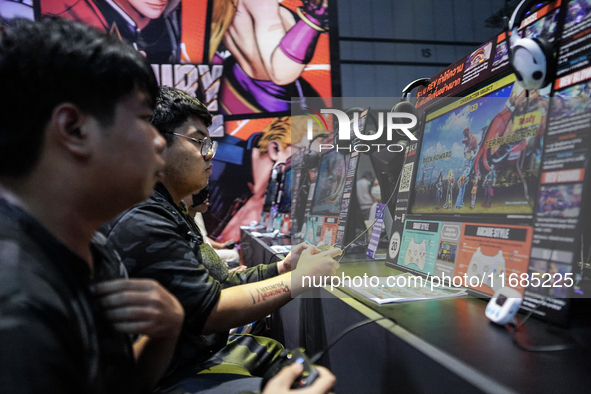 Gamers play video games at the Thailand Game Show 2024 in Bangkok, Thailand, on October 20, 2024. The Thailand Game Show 2024 gaming event t...