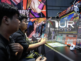 Gamers play video games at the Thailand Game Show 2024 in Bangkok, Thailand, on October 20, 2024. The Thailand Game Show 2024 gaming event t...