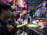 Gamers play video games at the Thailand Game Show 2024 in Bangkok, Thailand, on October 20, 2024. The Thailand Game Show 2024 gaming event t...