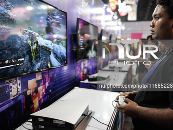 Gamers play video games at the Thailand Game Show 2024 in Bangkok, Thailand, on October 20, 2024. The Thailand Game Show 2024 gaming event t...