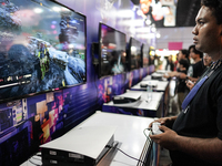 Gamers play video games at the Thailand Game Show 2024 in Bangkok, Thailand, on October 20, 2024. The Thailand Game Show 2024 gaming event t...