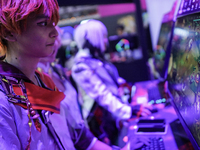 Gamers play video games at the Thailand Game Show 2024 in Bangkok, Thailand, on October 20, 2024. The Thailand Game Show 2024 gaming event t...