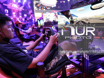 Gamers play video games at the Thailand Game Show 2024 in Bangkok, Thailand, on October 20, 2024. The Thailand Game Show 2024 gaming event t...