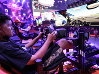 Gamers play video games at the Thailand Game Show 2024 in Bangkok, Thailand, on October 20, 2024. The Thailand Game Show 2024 gaming event t...