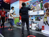 Gamers play video games with the Nintendo Switch at the Thailand Game Show 2024 in Bangkok, Thailand, on October 20, 2024. The Thailand Game...