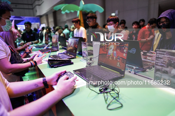 Gamers play video games at the Thailand Game Show 2024 in Bangkok, Thailand, on October 20, 2024. The Thailand Game Show 2024 gaming event t...