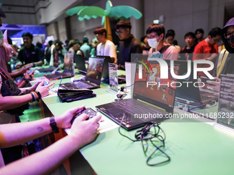 Gamers play video games at the Thailand Game Show 2024 in Bangkok, Thailand, on October 20, 2024. The Thailand Game Show 2024 gaming event t...