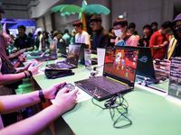 Gamers play video games at the Thailand Game Show 2024 in Bangkok, Thailand, on October 20, 2024. The Thailand Game Show 2024 gaming event t...